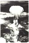  The mushroom cloud of the 22-kiloton atomic bomb dropped on Nagasaki rises menacingly over the city, 9 August 1945.  The location of Nagasaki amidst a series of narrow valleys had the effect of shielding some parts of the city from the full effects of the blast and more than a third of its buildings were left undamaged.  Nonetheless just over half the population of 270,000 people were killed or injured.