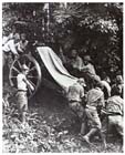 Japanese troops manhandling a Type 41 75mm infantry gun through the jungle, Malaya, 22 January 1942.  The Japanese Army had spent most of the previous decade preparing to fight the Soviets in Manchuria while waging a real war against the rest of China: it was woefully ill-equipped for tropical warfare.  Nevertheless, the stoic endurance, discipline and determination of its soldiers saw the Japanese Army overwhelm the equally ill-prepared British and American forces arrayed against it in the first months of 1942.