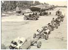 A load of 250-lb bombs being ferried out to a row of Beaufort bombers belonging to 100 Squadron RAAF, prior to a raid on Japanese positions in the Torricelli Mountains, March 1945.  While the RAAF air support was invaluable to the Australian troops on the ground, air operations were hampered by fuel and ammunition shortages.  These shortages reflected the low priority of the campaign compared to other Allied operations when it came to the allocation of supplies and shipping in the final months of the Pacific War.