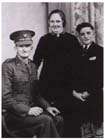 A family portrait of Albert Moore, in his Salvation Army Officer Uniform, with his wife Violet and son Kelvin taken in 1940 prior to his embarkation to New Guinea.