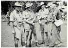 In a forward area on the Kokoda Trail, Brigadier Arnold Potts (far left) commanding the 21st Infantry Brigade in August 1942. This is where Potts devised his strategy of a fighting retreat to wear down his opponent, Major General HORII Tomitaro's South Seas Force, to buy time to deploy additional Australian forces.