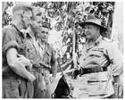 General Sir Thomas Blamey (far right), talking to Australian troops in New Guinea, January 1944.  Blamey’s appointment as Commander, Allied Land Forces SWPA, was quickly revealed to be a hollow one as MacArthur skillfully undermined his position at every turn.  Although in theory Blamey was the Australian government’s principal military advisor he found himself in the surreal situation of being left out of crucial meetings between his own Prime Minister, Curtin, and MacArthur.  