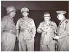Four powerful Allied figures gather during the dark days of 1942. Major General George Kenney,(right) with Mr Frank Forde, Australian Minister for the Army, General Douglas MacArthur and General Thomas Blamey during the groups visit to New Guinea on 12 September 1942.
