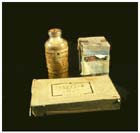 The three anti-malarial drugs used by Japan, (left to right, front to back) injectable Atabrine, Plasmochin, and quinine.