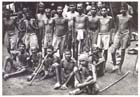 A group of newly liberated Indian prisoners of war at Kumuia Yama, New Britain, 17 September 1945.  Weak and malnourished, the condition of these men reflects the harsh regime imposed upon them by their Japanese captors.  While the exact number of Indian prisoners of war who died in New Guinea remains uncertain it is generally agreed that at least some groups of them suffered a higher rate of mortality than their European counterparts.