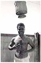 Jemedar Chint Singh, after his liberation from the Japanese prisoner-of-war camp at Marienberg, enjoys a field shower at 2/15th Field Ambulance at Boram Beach on 14 October 1945.